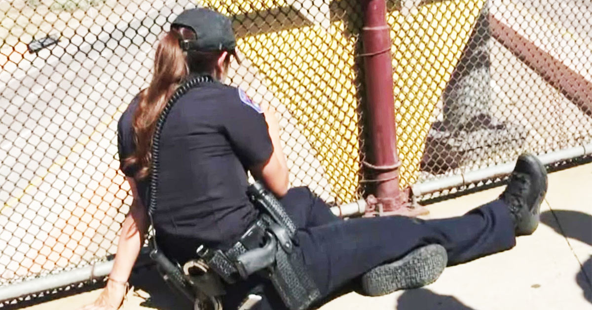 Drivers Notice Two Female Cops On An Overpass, But Upon Closer Inspection Realize - They're Not Alone